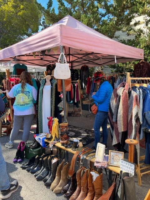 EXPLORING OJAI: Tourists walk around the bustling market while browsing sustainable products.