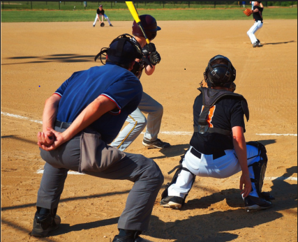 Umpires constantly focus on the ball game they are administering. In between pitches they are at ease and standing up straight, but the moment the pitcher begins their windup, the umpire crouches down into the saddle position, ready for the next pitch. The saddle position is depicted in the image above. 

