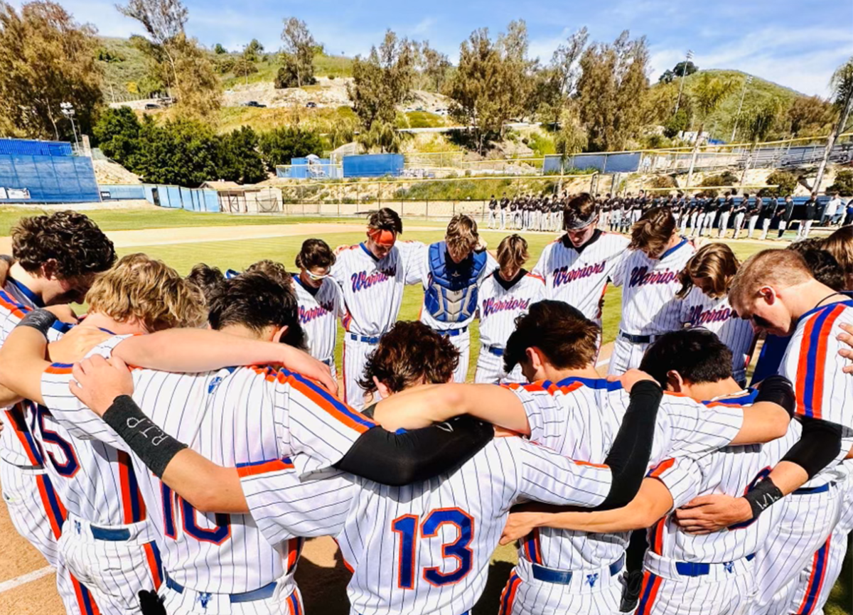 Varsity baseball gathers up in a team huddle before their game against Sylmar High School on March 1. The team overtakes SHS 20–0.
