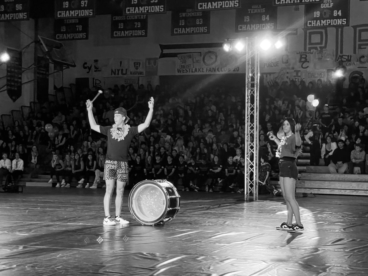 LEADING THE TRIBE: Noah Stead and Jordyn Dyer head the tribe chant for the WHS student body. This was one of the first tasks they led as the new MCs. 