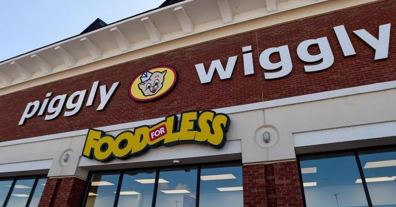 Piggly Wiggly mascot Mr. Pig at a grocery store grand opening